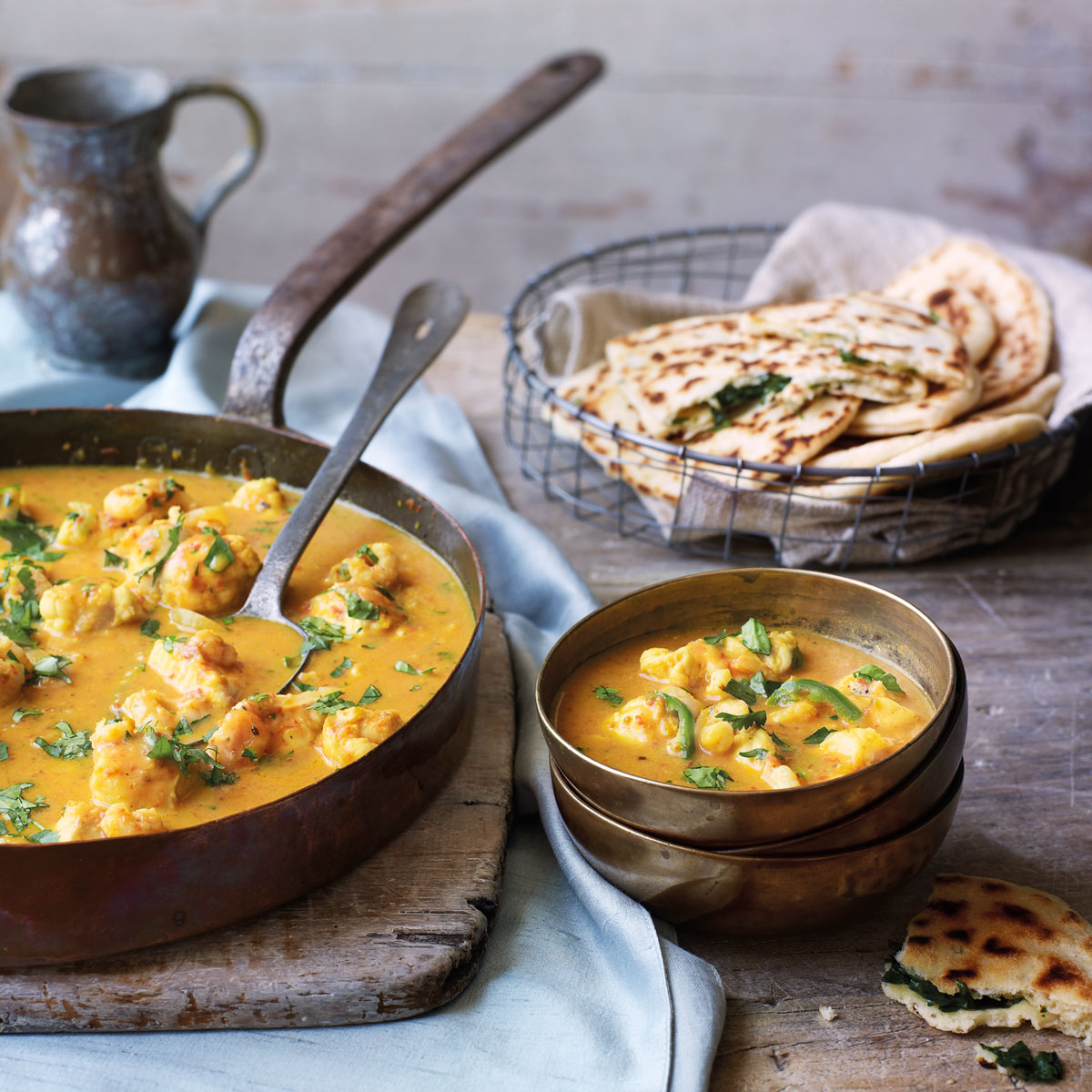 goan-fish-curry-in-pan-goan-fish-curry-with-garlic-and-coriander-naans-curry-recipe-goodhousekeeping-co-uk